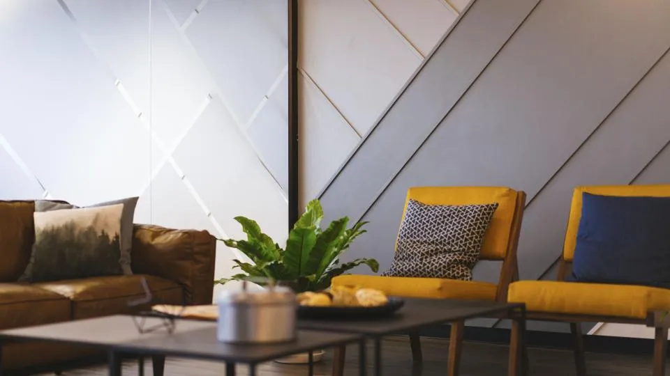 Modern living room with a sofa and armchairs
